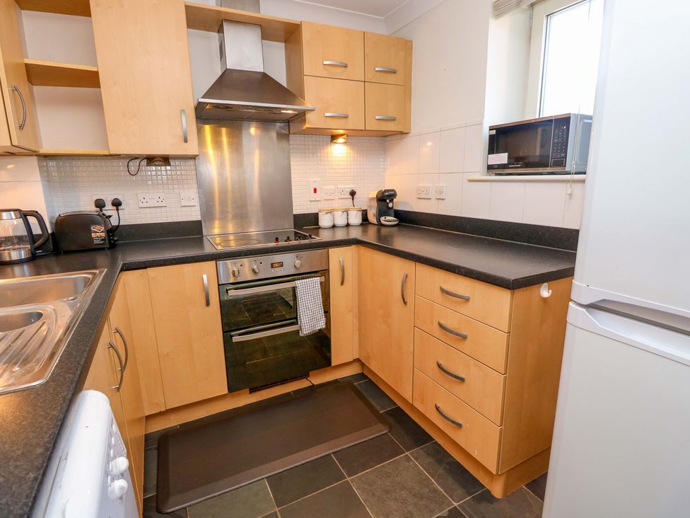 A kitchen with appliances and cabinets at 53 Orchard Place