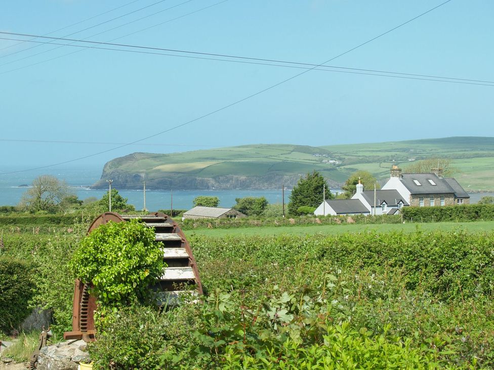 A coastal view with hills and houses at Ty Fferm in Newport