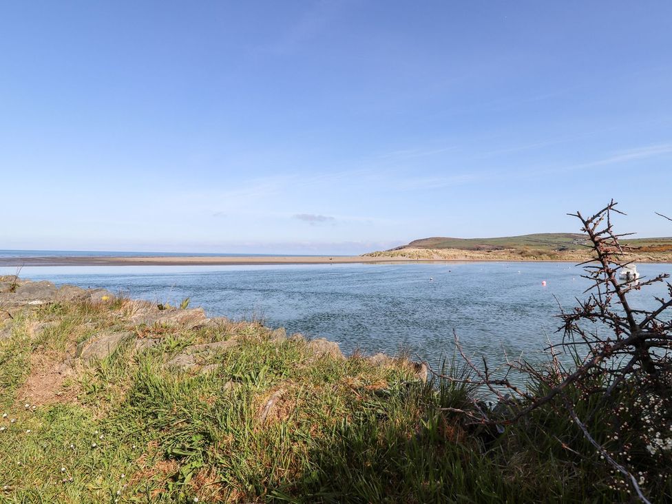 A view of water and hills at Ty Fferm in Newport