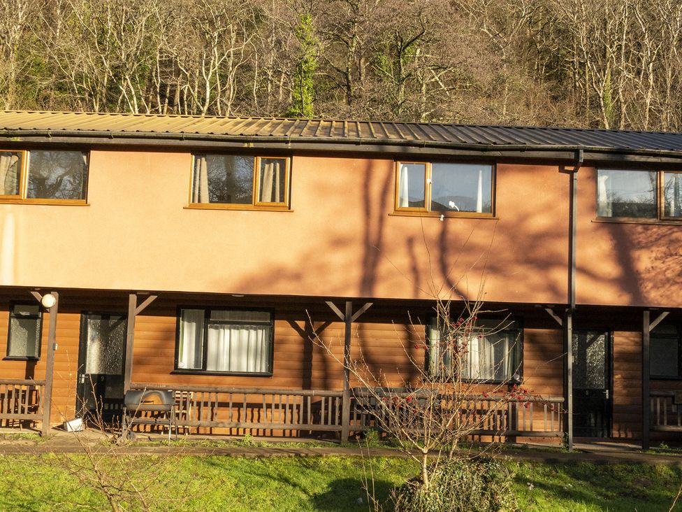 A building with windows and a porch at 2 bedroom Cabin No.1 Port Talbot