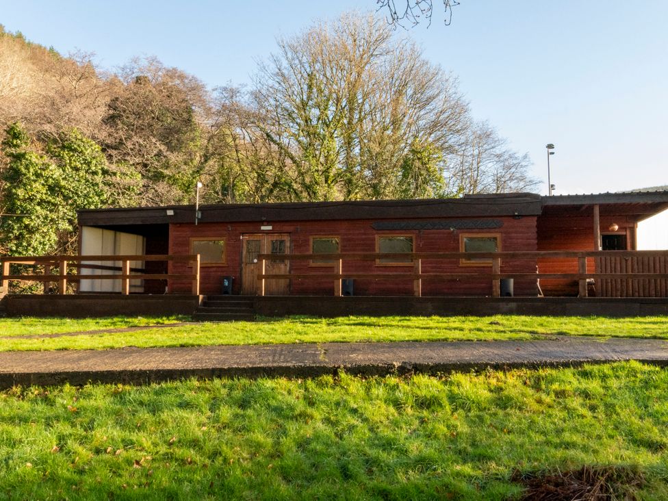 A cabin with a deck and pathway at 2 bedroom Cabin No.1 in Port Talbot