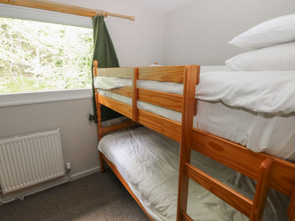 A bunk bed with mattresses in a bedroom at Cabin No. 13 - Salt and Fern Cabins Goytre near Port Talbot