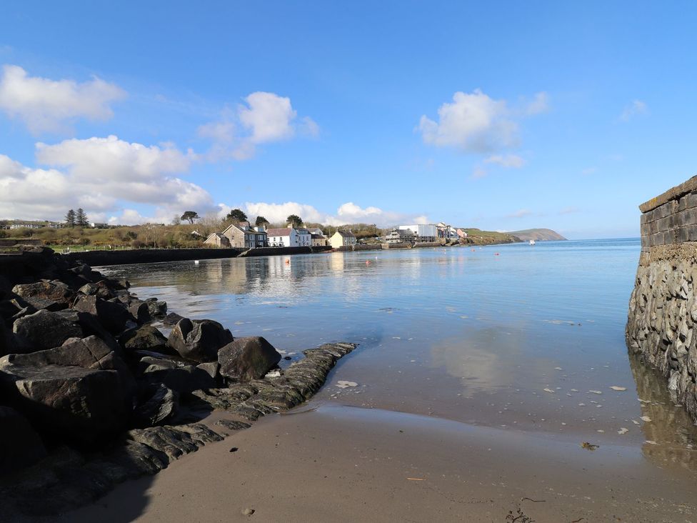 A view of water and buildings at Ty Gwartheg in Newport