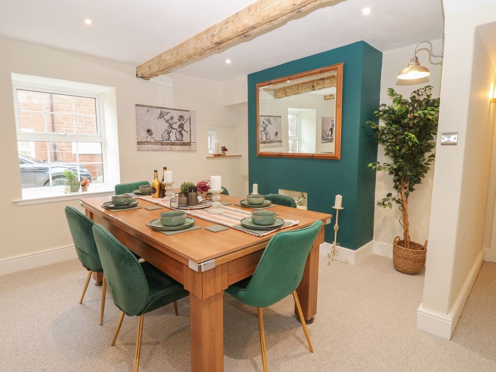 A dining room with a table and chairs at Broadwath Old House in Heads Nook