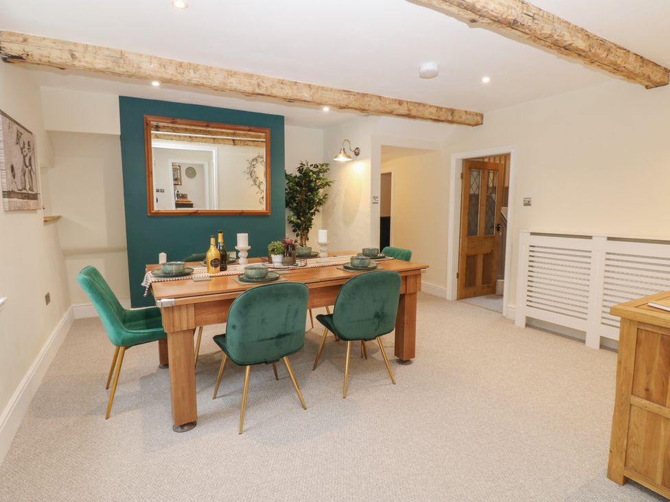 A dining room with a table and chairs at Broadwath Old House Heads Nook