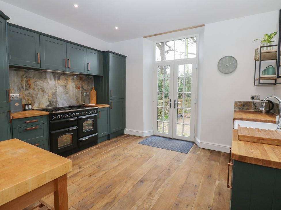 A kitchen with cabinets and an oven at Broadwath Old House in Heads Nook