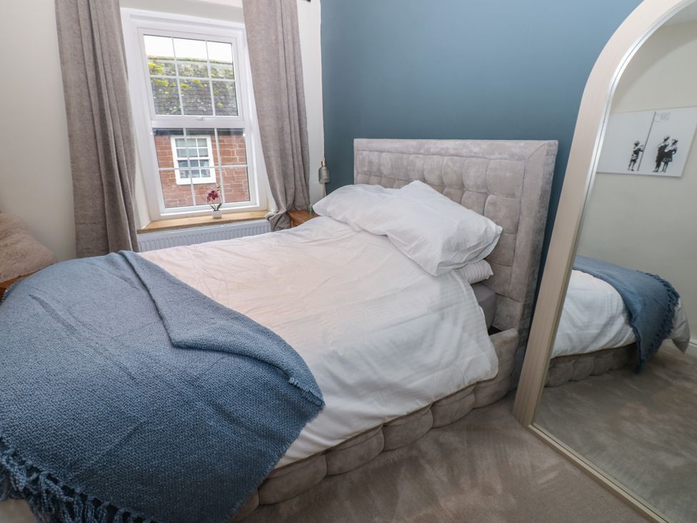 A bedroom with a bed and window at Broadwath Old House in Heads Nook