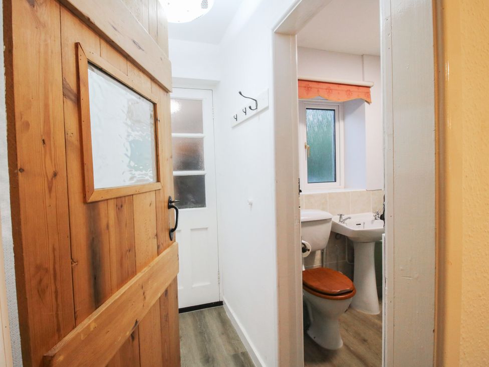 A bathroom with toilet and sink at Bumble Bee at 2 Clematis Cottage near Clee Hill