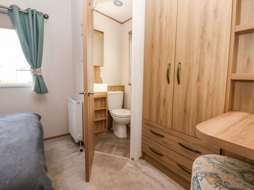A bedroom with an ensuite bathroom area at The Drift near High Skirlington