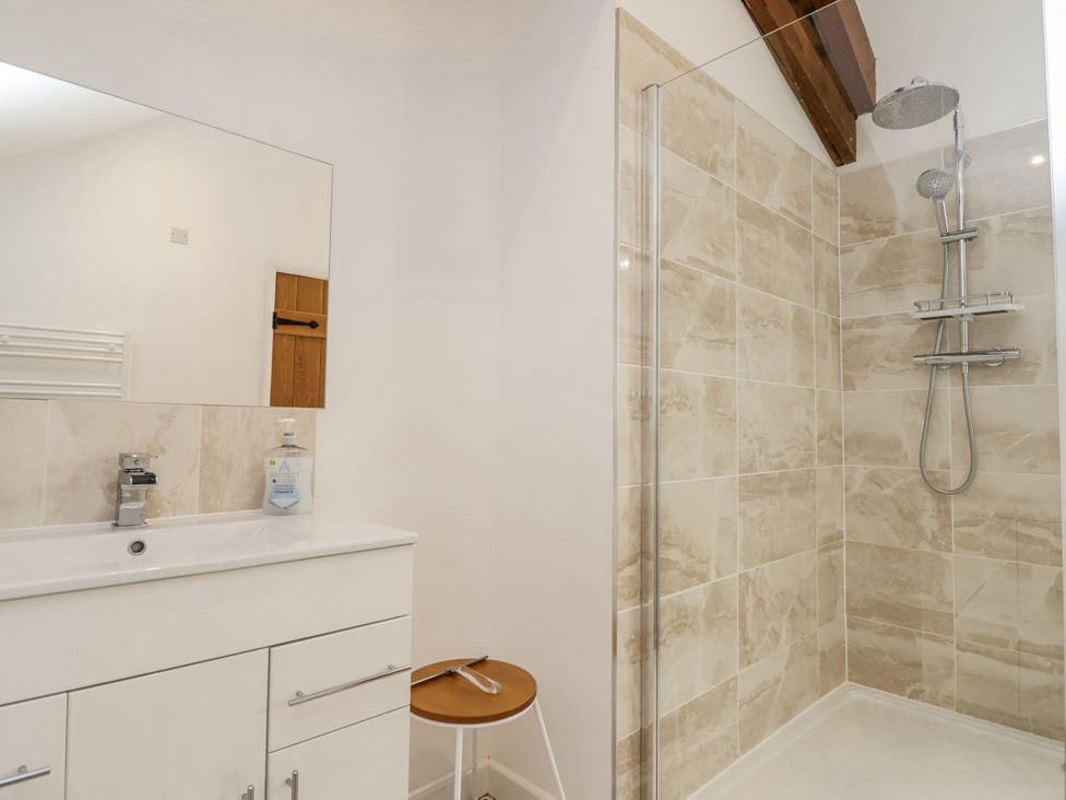 A bathroom with a sink and shower at Swallow Cottage Bullhornstone near South Brent