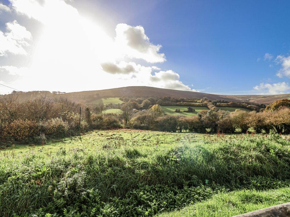 A view of hills and trees at Swallow Cottage Bullhornstone near South Brent
