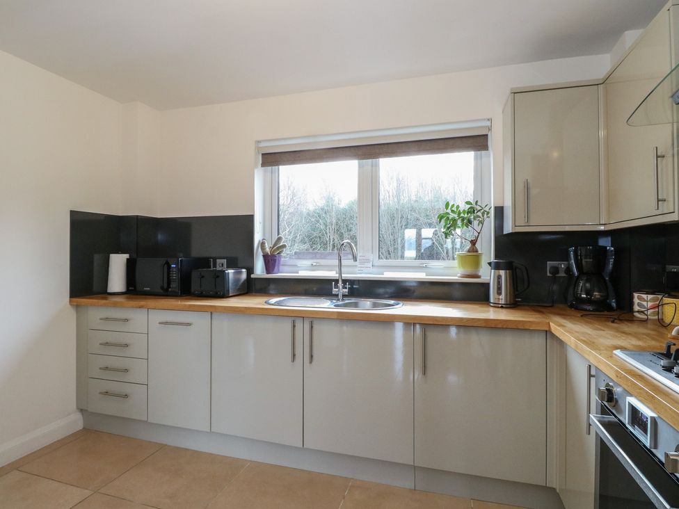 A kitchen with a sink and appliances at Lurach House Port Appin