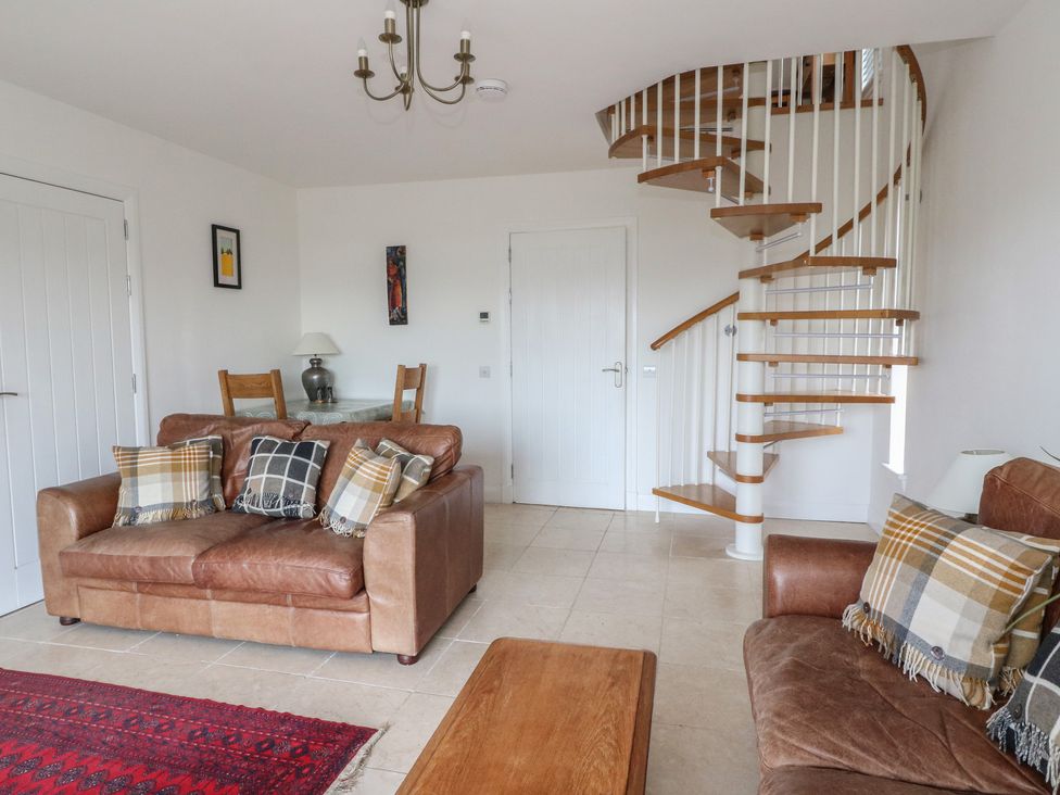 A living room with a sofa and coffee table at Sealladh in Appin