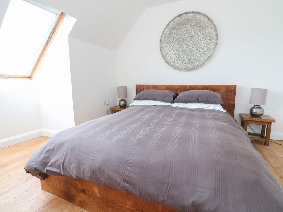 A bedroom with a bed and window at Sealladh in Appin