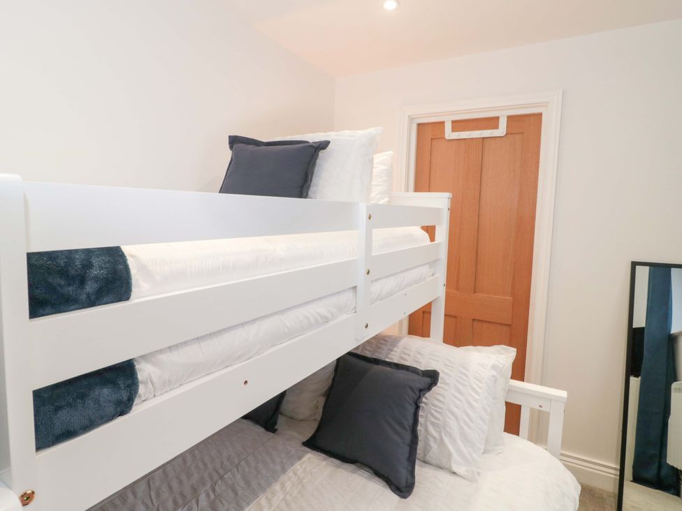 A bunk bed with pillows in a bedroom at 2 Stroud Bungalows