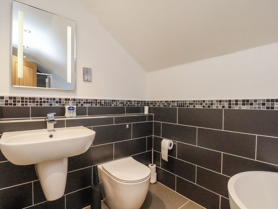 A bathroom with a sink and toilet at Chestnut Barn Aislaby near Whitby