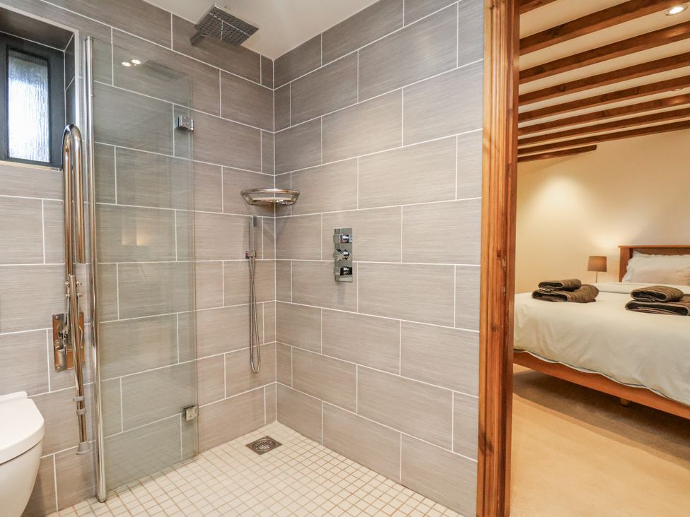 A bathroom with a shower and toilet at Chestnut Barn Aislaby near Whitby