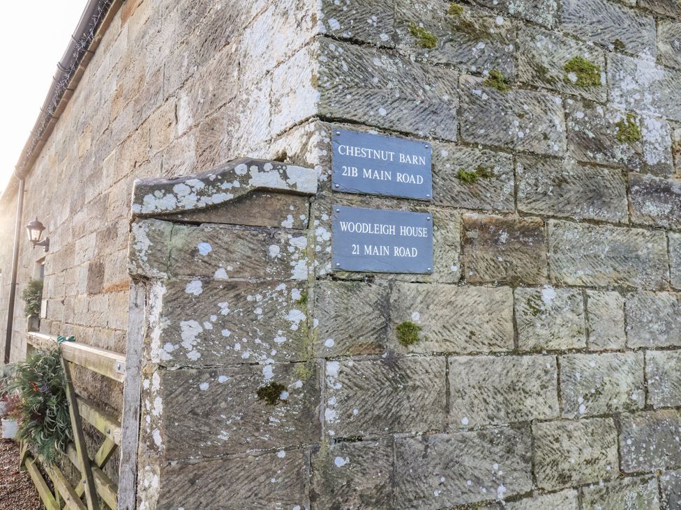 An outdoor wall with nameplates at Chestnut Barn in Aislaby near Whitby