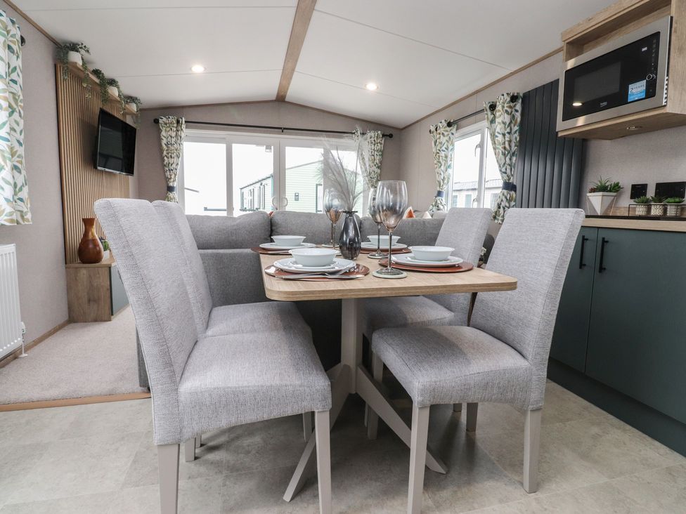 A dining area with a table and chairs at The Retreat in Morecambe