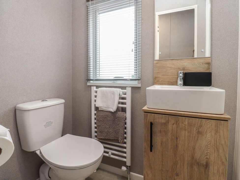 A bathroom with a sink and toilet at The Retreat in Morecambe