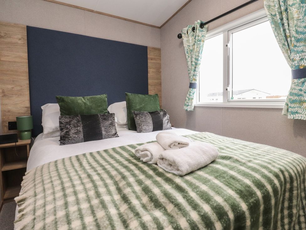 A bedroom with a bed and pillows at The Retreat in Morecambe