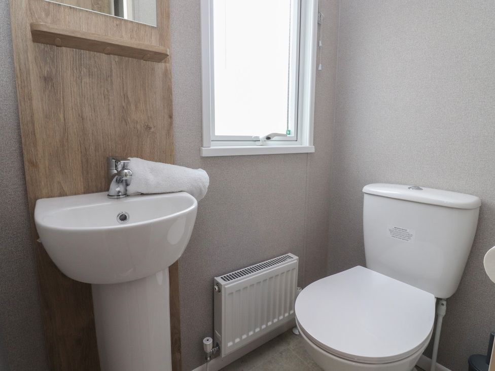 A bathroom with a sink and toilet at The Retreat in Morecambe