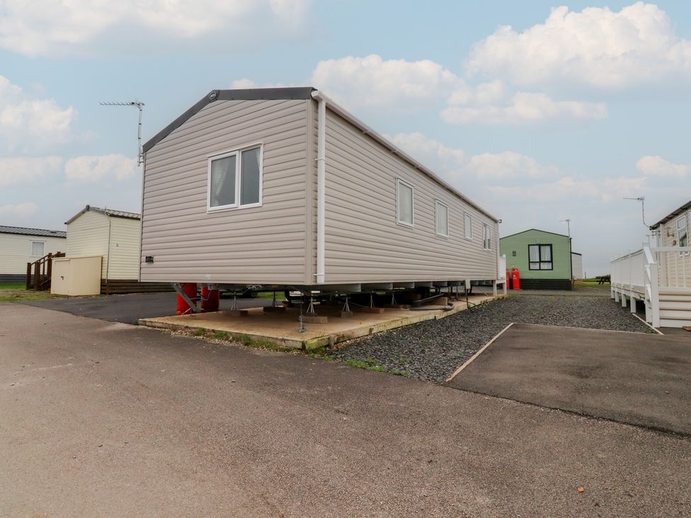 A mobile home with a window and an antenna at The Retreat in Morecambe