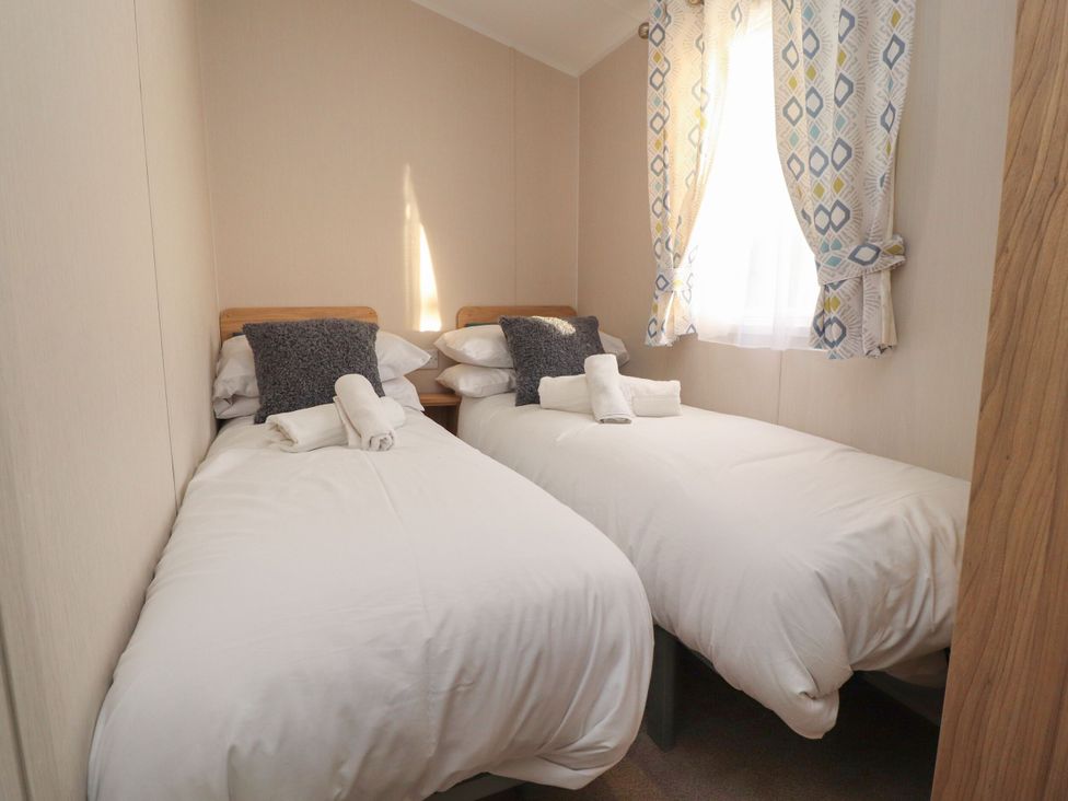 A bedroom with two beds at Poppy Lodge in Morecambe