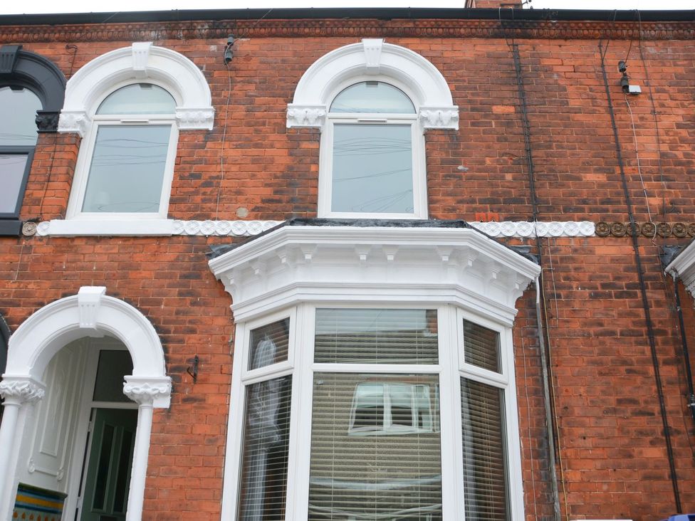 Front facade of a brick building with bay windows at Anchor Cottage Cleethorpes