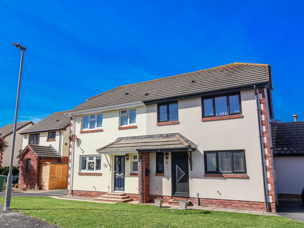 A house with multiple windows and a front door at Sea Spray in Westward Ho!