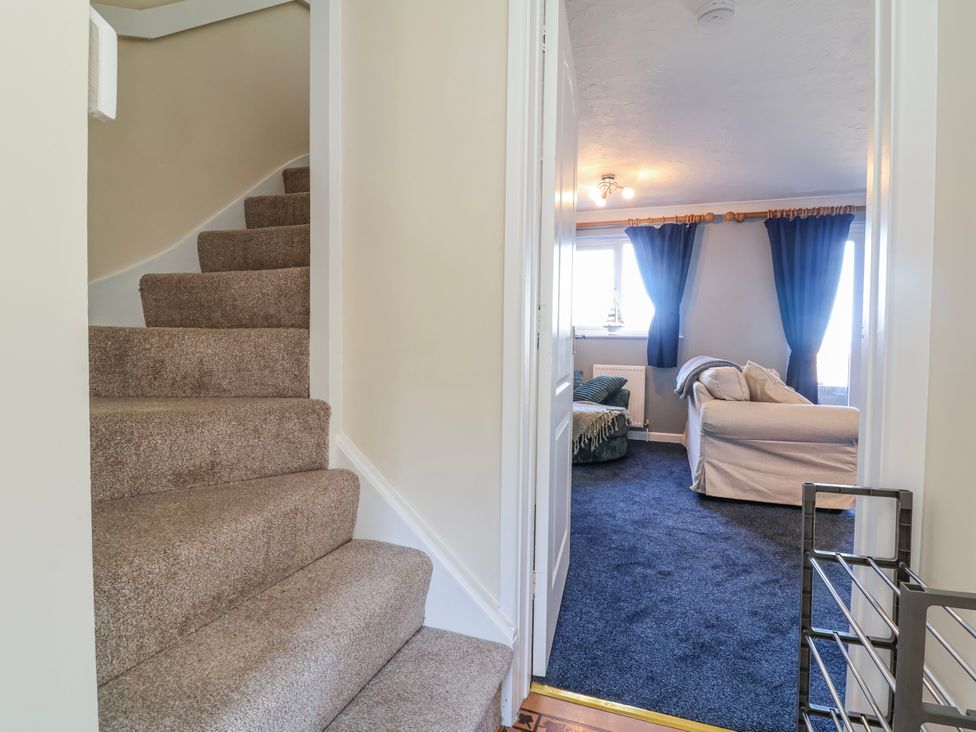 A view of stairs leading to a living room at Sea Spray in Westward Ho!