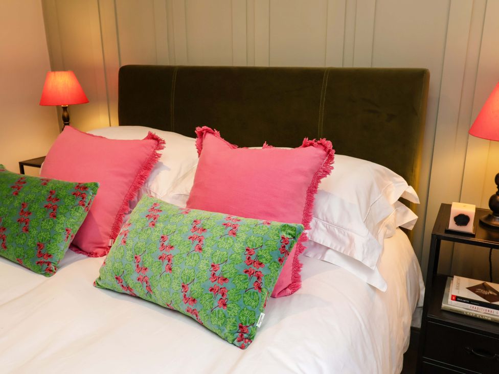A bedroom with a bed and pillows at Fairview in Darsham
