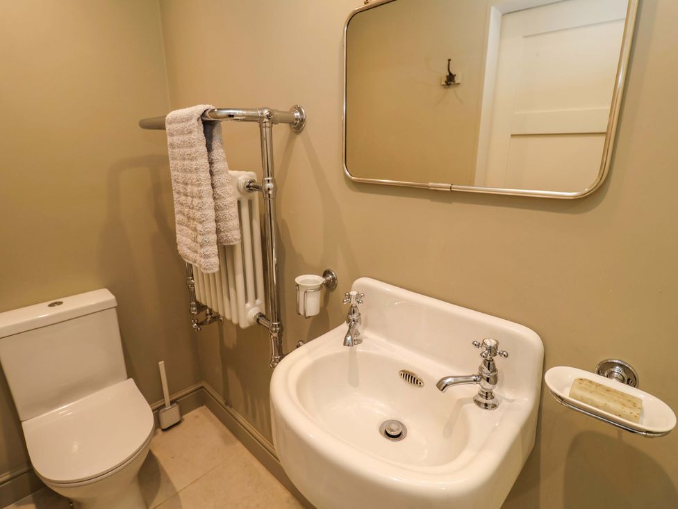 A bathroom with a toilet and sink at Fairview in Darsham
