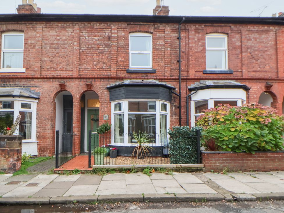 A brick facade with windows and door at 50 Gladstone Avenue Chester
