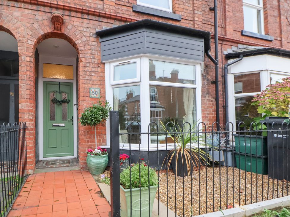 A front entrance with a green door and plants at 50 Gladstone Avenue Chester