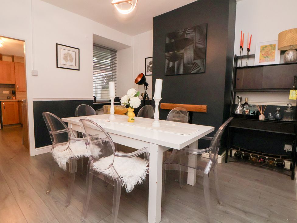 A dining room with a table and chairs at 50 Gladstone Avenue Chester