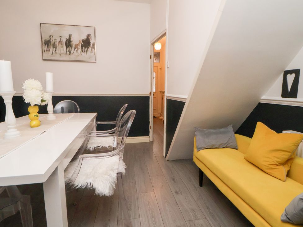 A dining room with a table and chairs at 50 Gladstone Avenue Chester