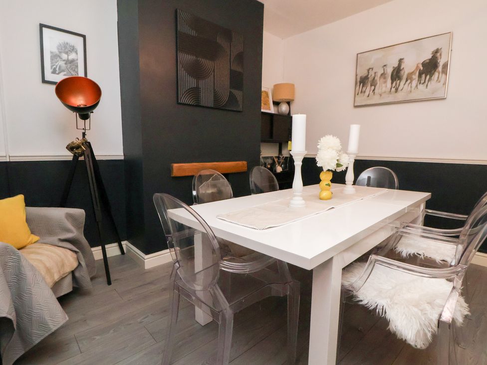 A dining room with a table and chairs at 50 Gladstone Avenue Chester