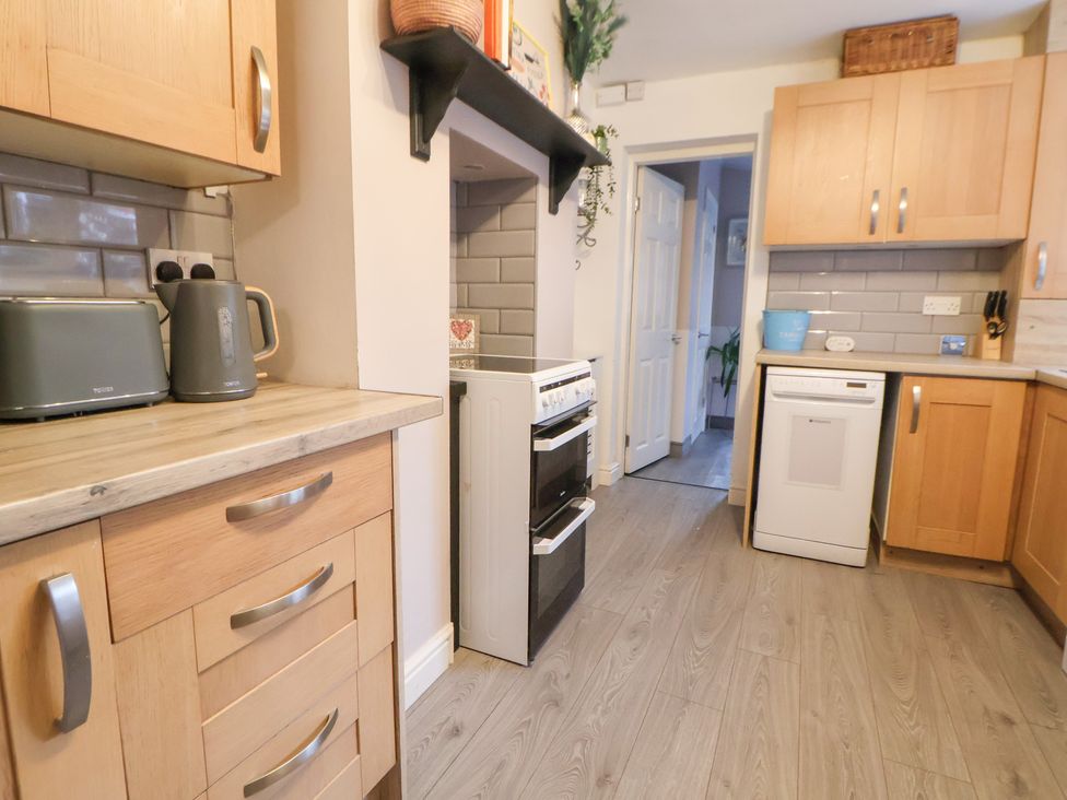 A kitchen with cabinets and appliances at 50 Gladstone Avenue Chester