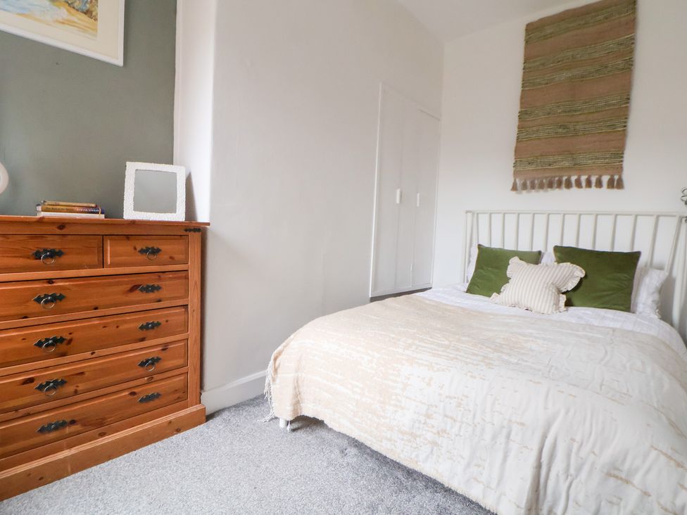 A bedroom with a bed and dresser at 50 Gladstone Avenue Chester