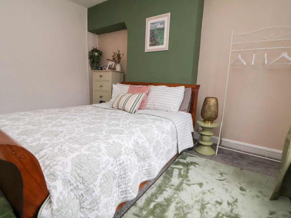 A bedroom with a bed, bedside table, and dresser at 50 Gladstone Avenue Chester