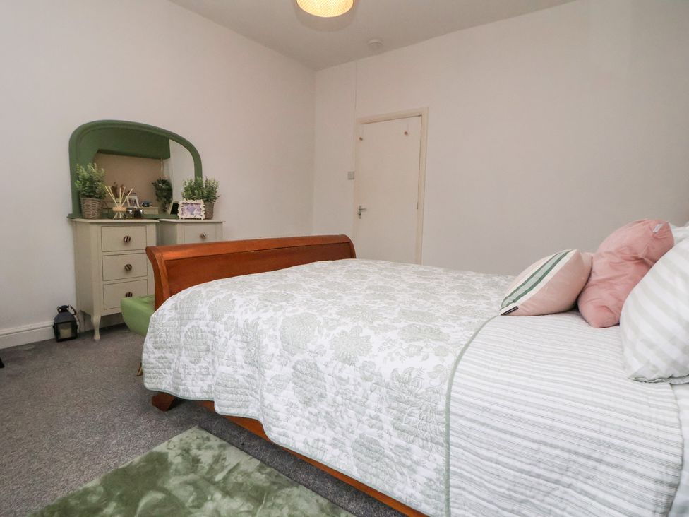A bedroom with a bed and dresser at 50 Gladstone Avenue Chester