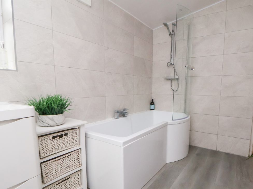 A bathroom with a bathtub and shower at 50 Gladstone Avenue in Chester