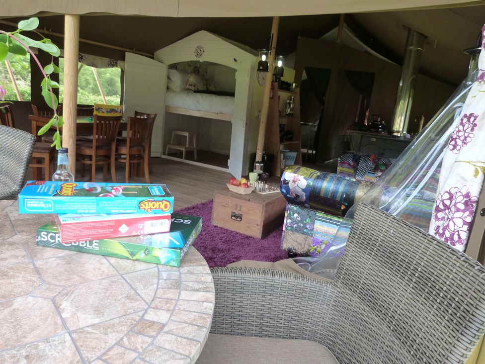 A living room with games and furniture at Aeron in Newcastle Emlyn