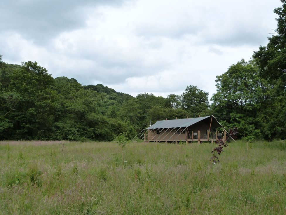 A tent structure in a grassy area at Aeron in Newcastle Emlyn