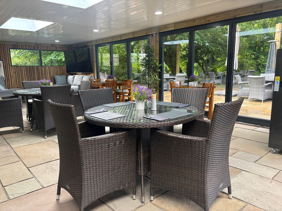 A dining area with tables and chairs at Aeron in Newcastle Emlyn