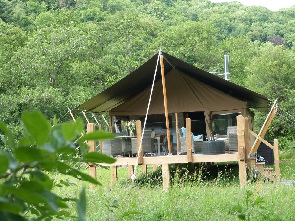 A tent structure on a deck in a natural setting at Teifi in Newcastle Emlyn