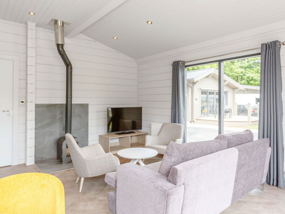 A living room with a sofa and chairs at Leyburn