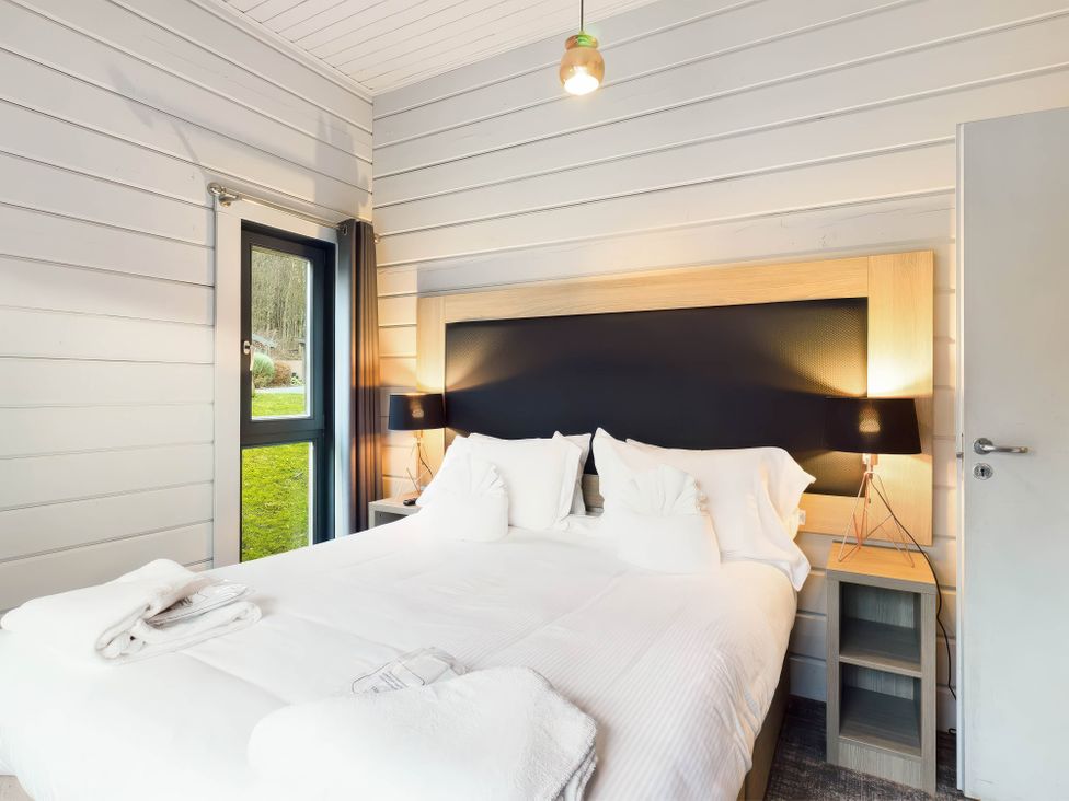 A bedroom with a bed and bedside table at Leyburn