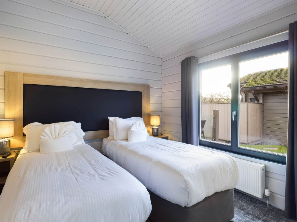 A bedroom with two beds and a window at Leyburn (Pet) in Leyburn